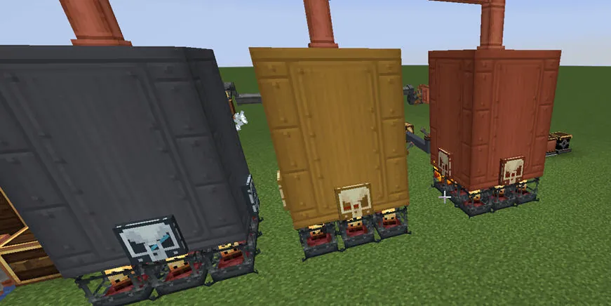 Three coloured engine blocks side by side